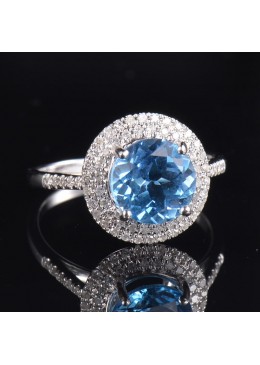 Inel din aur cu anturaj de diamante si piatra topaz bleu